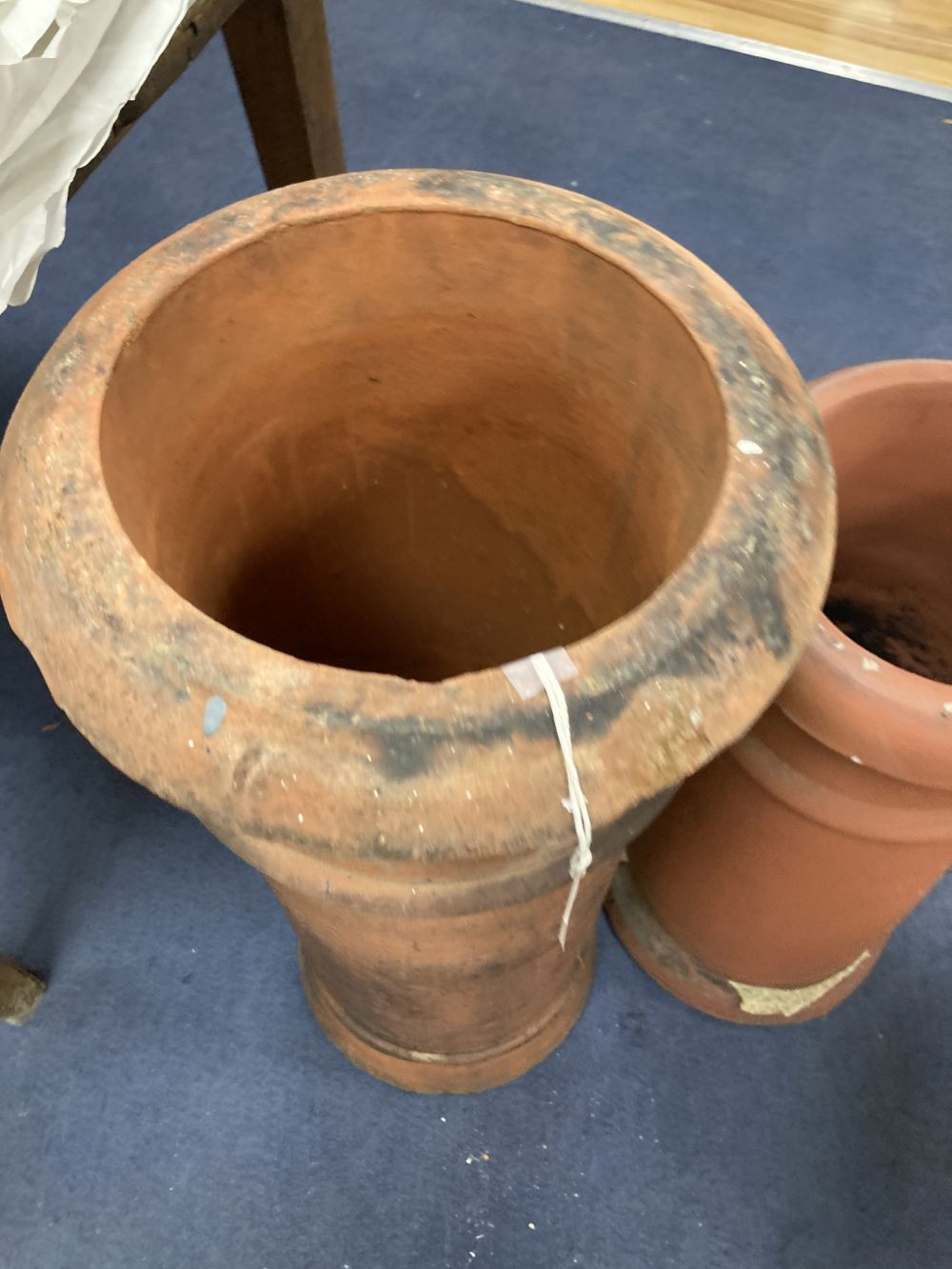 Two terracotta chimney pots, tallest 77cm